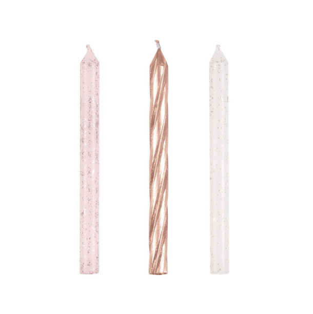 Three candles with different designs on a white background the package contains 24 candles 8 of each shown
