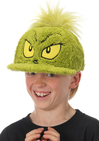 Child wearingOfficially licensed Dr. Seuss Grinch Fuzzy Cap with embroidered face. 