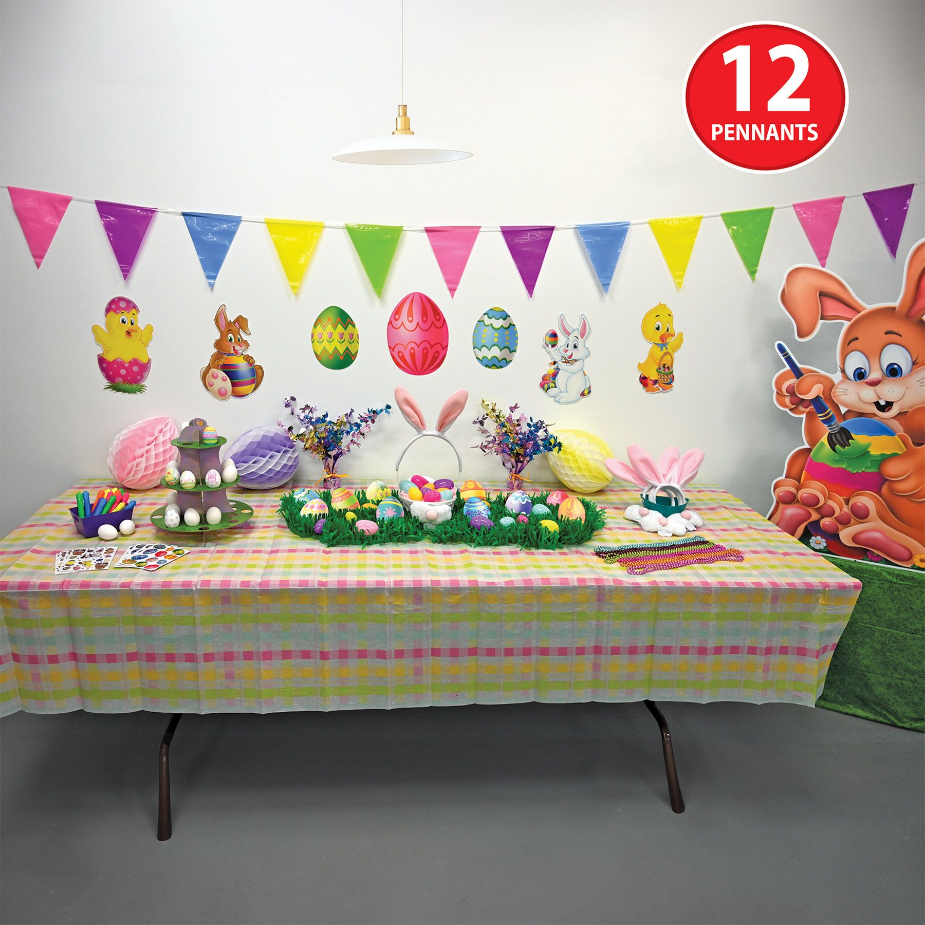 Easter and spring party setup inside with pastel party banner on wall above easter cutouts 