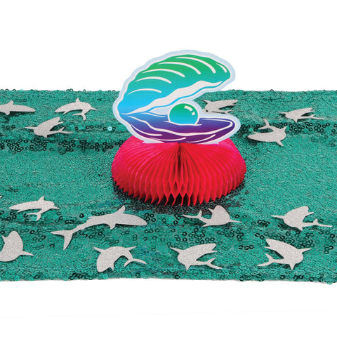Shark confetti scattered on party table for Shark Week or beach party décor