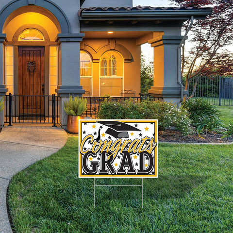 Congrats Grad plastic yard sign with metal stake on display in front of a home.