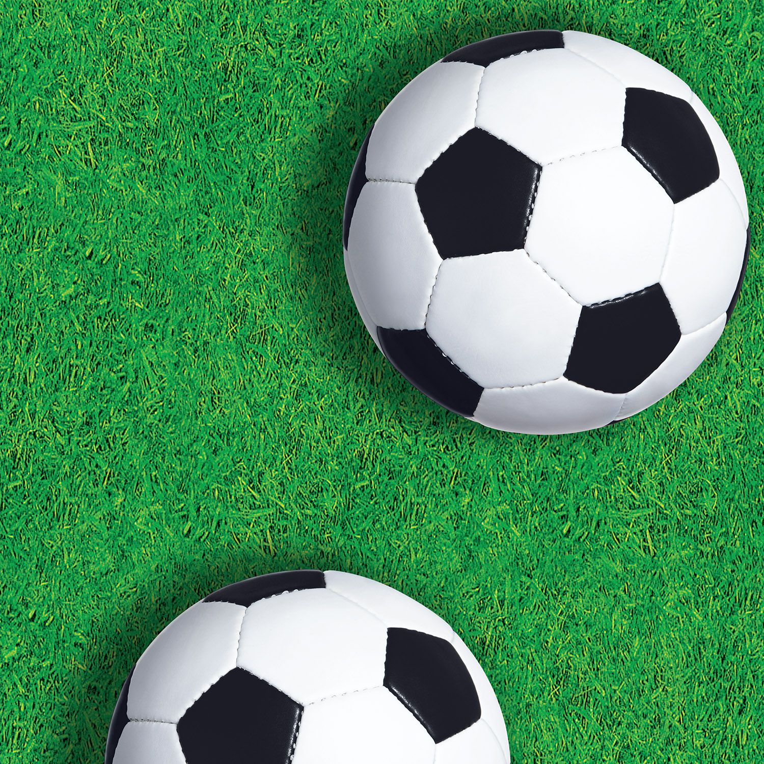 Close-up of soccer table cover showing green pitch and large soccer ball print