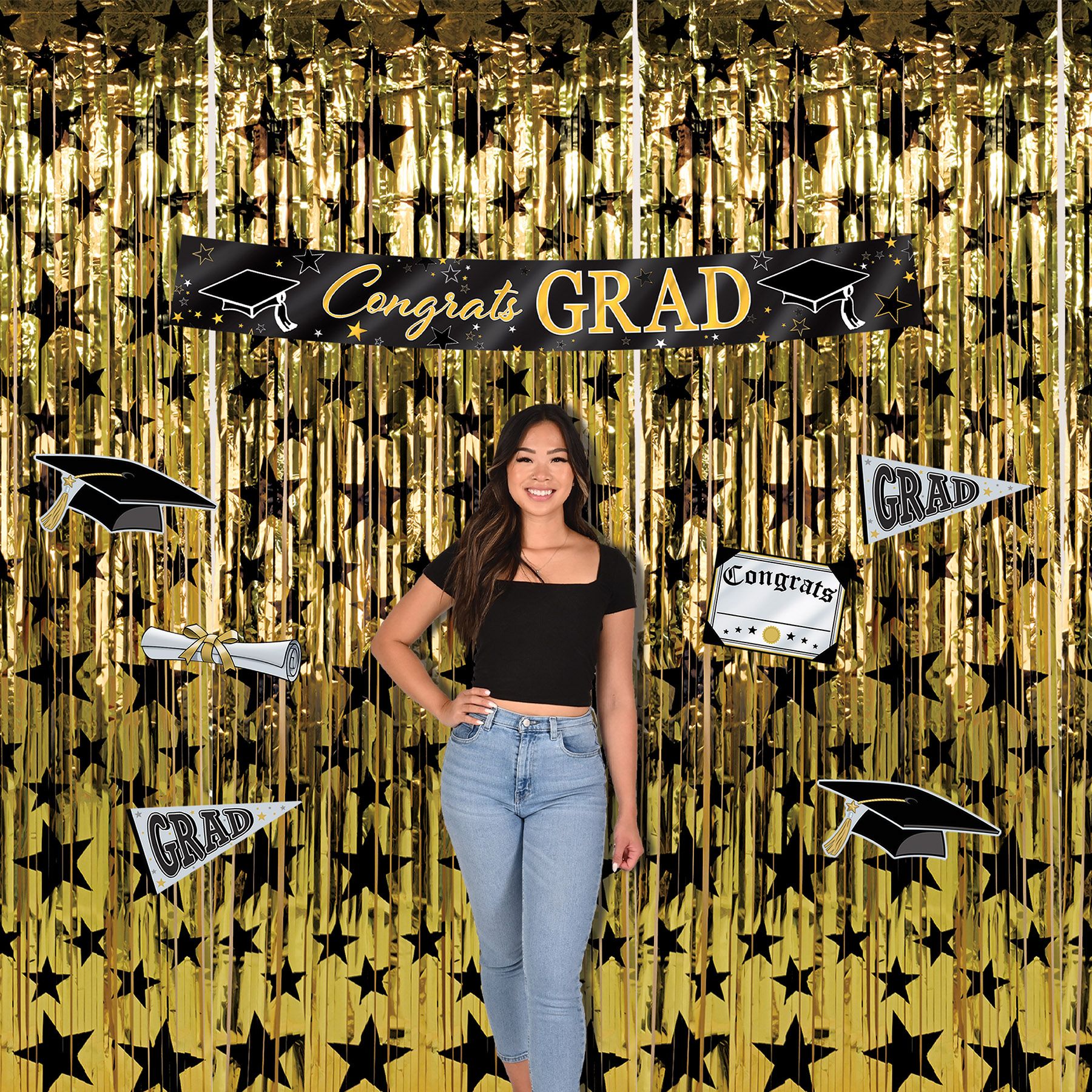 Black graduation banner featuring metallic gold Congrats Grad lettering  headlining a phot back drop.