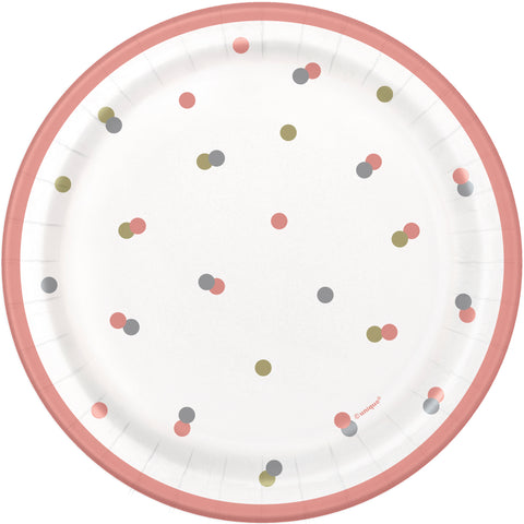 Paper plate with colorful polka dots and a pink rim on a white background