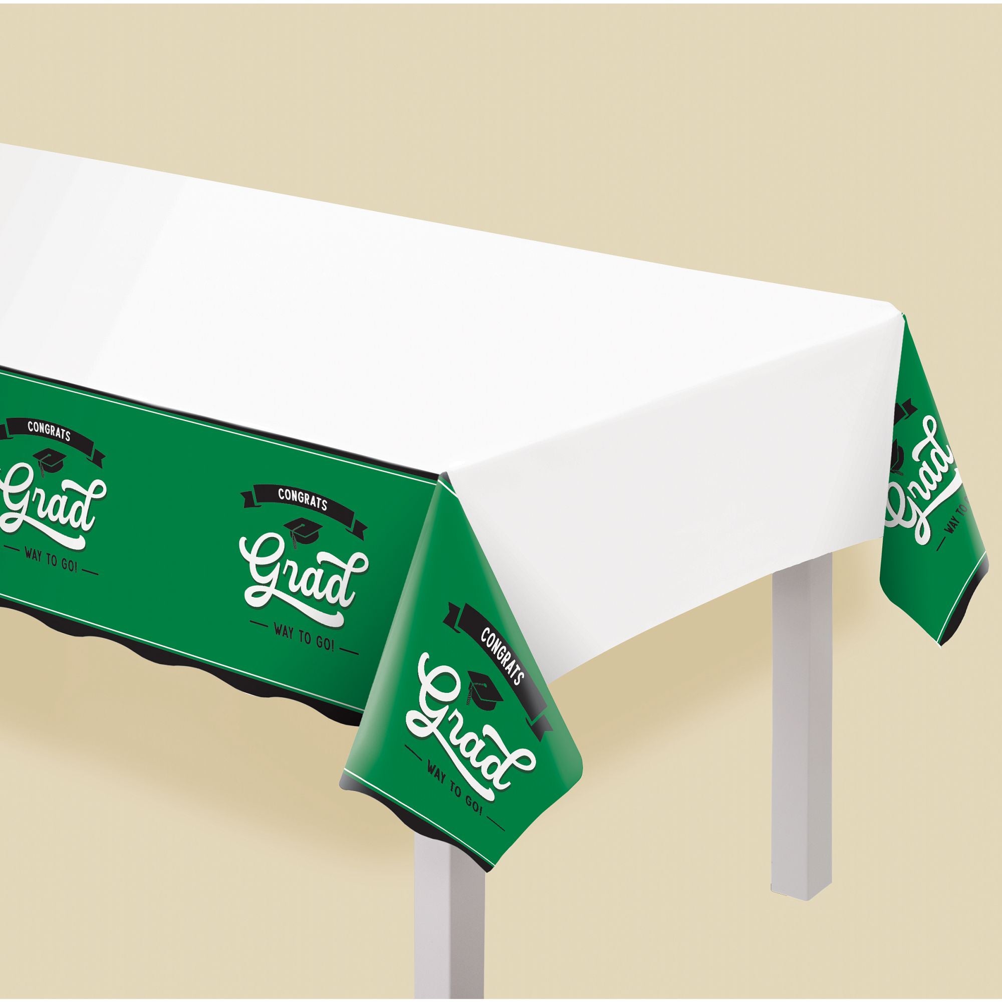 Green graduation plastic table cover 54x102 from Party Fair in Manahawkin NJ displayed on party table
