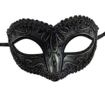 Antique.black Venetian Masquerade Mask in Manahawkin, NJ at Party Fair, shown close up with elegant scrollwork and decorative beaded trim.