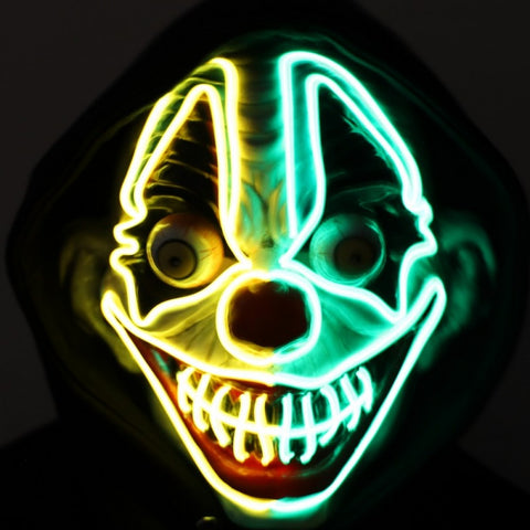 Light-Up Neon Evil Clown Mask displaying its glowing facial outlines in a vibrant neon yellow and green.